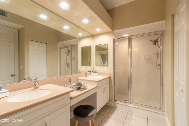 bathroom with vanity, tile patterned floors, and a shower with shower door