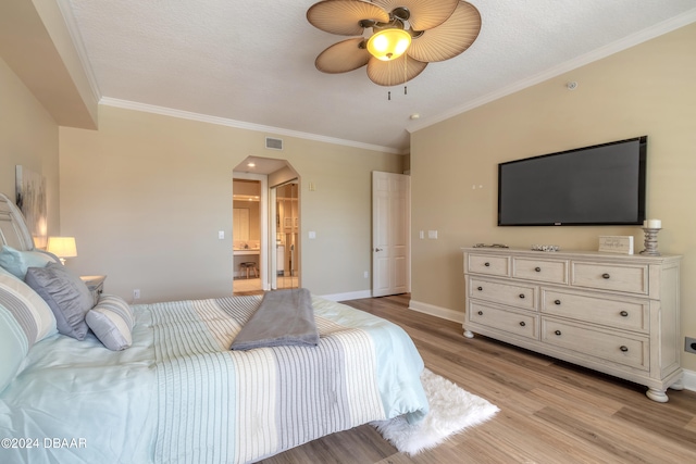 bedroom featuring ceiling fan, a textured ceiling, light hardwood / wood-style flooring, and crown molding