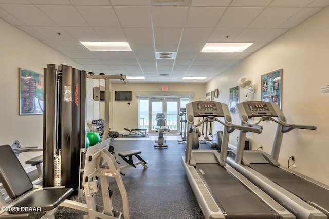 workout area with a paneled ceiling