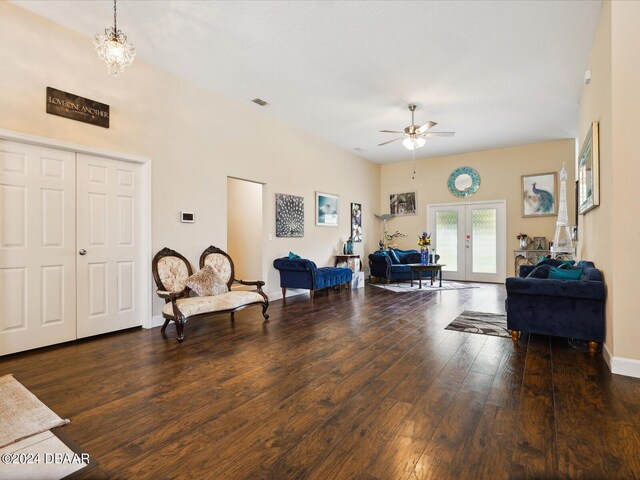 living room with dark wood-type flooring, french doors, and ceiling fan