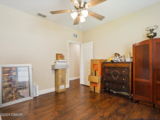 bedroom with ceiling fan and dark hardwood / wood-style floors