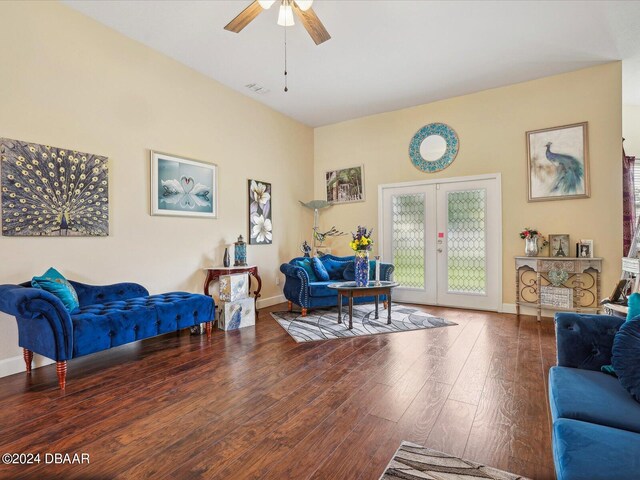 living room with hardwood / wood-style floors, ceiling fan, and french doors