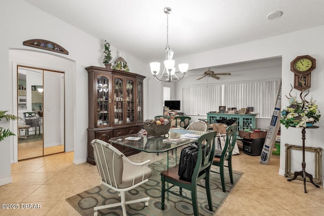 510 Torres Pl, Lady Lake, FL 32159 - dining area with a chandelier, light tile patterned flooring, and a ceiling fan