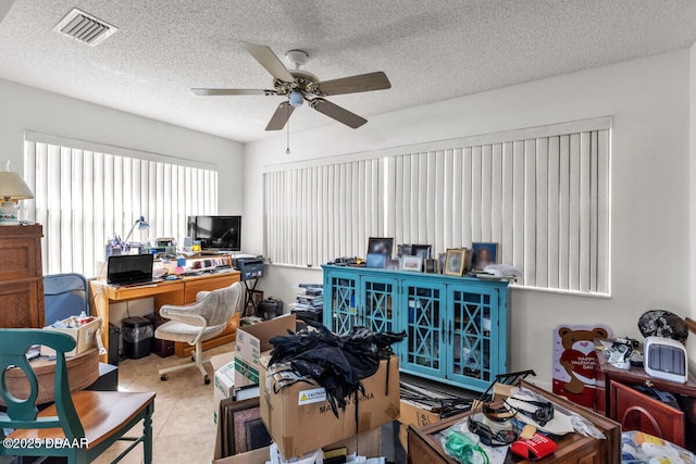 510 Torres Pl, Lady Lake, FL 32159 - home office with a ceiling fan, tile patterned flooring, and a textured ceiling