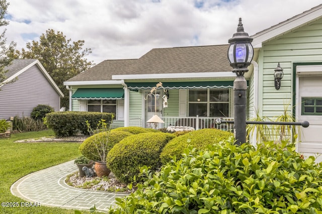 510 Torres Pl, Lady Lake, FL 32159 - view of front of home with a front lawn and a shingled roof
