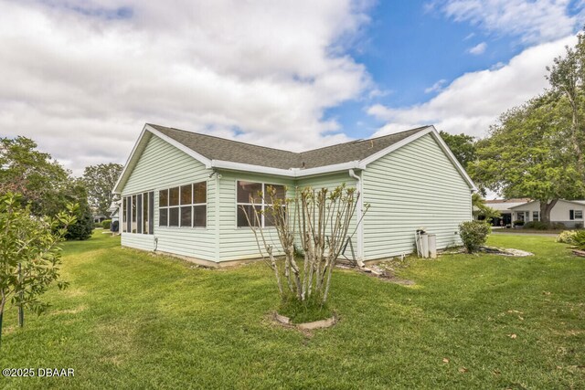 510 Torres Pl, Lady Lake, FL 32159 - view of property exterior featuring a yard and a shingled roof