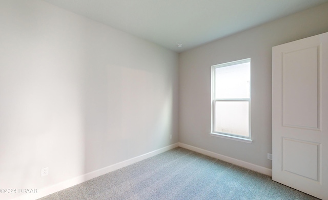 empty room featuring carpet flooring