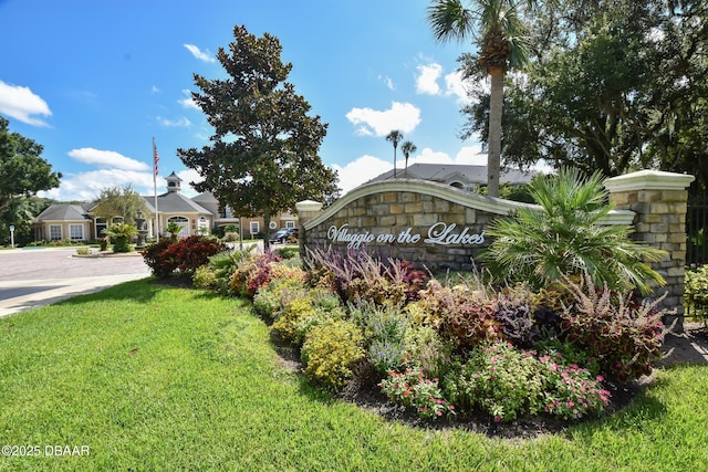 940 Village Trl Unit 2-106, Port Orange, FL 32127 - community / neighborhood sign featuring a lawn