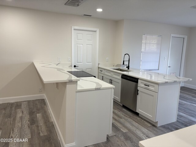 304 Jane Ann St, Port Orange, FL 32127 - kitchen with a peninsula, dishwasher, dark wood-style floors, white cabinets, and recessed lighting