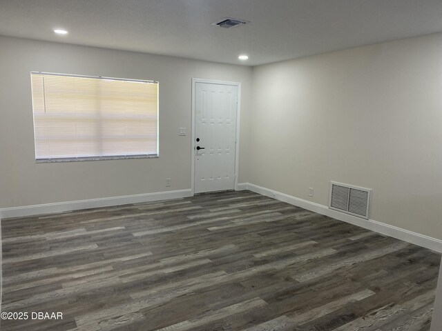304 Jane Ann St, Port Orange, FL 32127 - empty room featuring dark wood finished floors and recessed lighting
