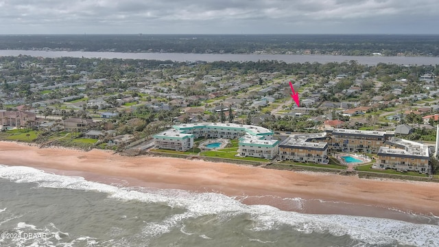 aerial view with a water view and a view of the beach