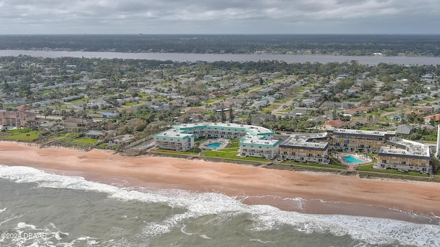 aerial view with a water view and a view of the beach