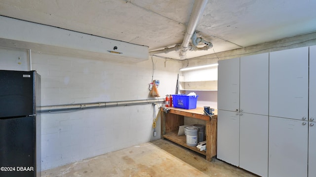 basement featuring black fridge