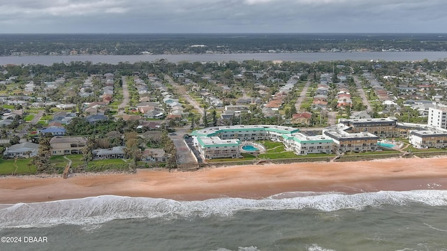 bird's eye view featuring a water view and a view of the beach