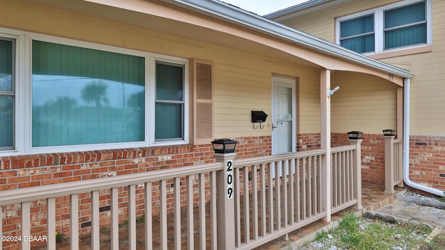 doorway to property featuring a porch