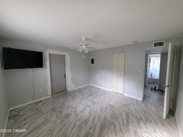 unfurnished bedroom featuring a closet and ceiling fan