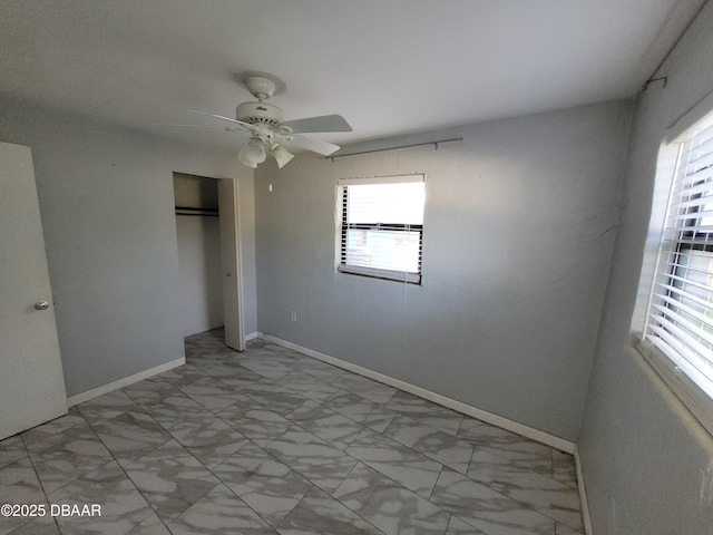 unfurnished bedroom with a closet and ceiling fan