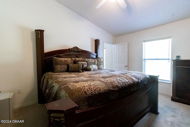 bedroom featuring lofted ceiling, carpet, and ceiling fan