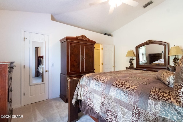 carpeted bedroom with vaulted ceiling and ceiling fan