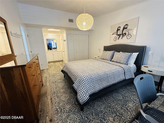 84 Heather Point Ct, New Smyrna Beach, FL 32169 - bedroom featuring light wood-style flooring and a closet