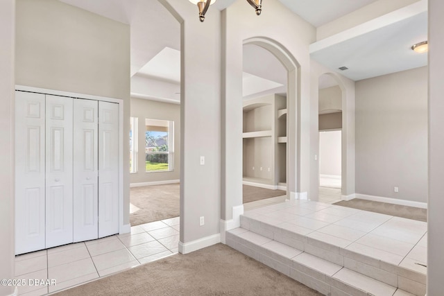 view of carpeted foyer