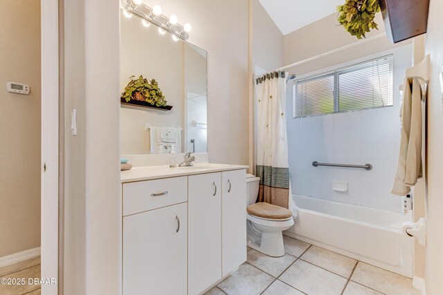 full bath with tile patterned flooring, shower / tub combo with curtain, toilet, and vanity