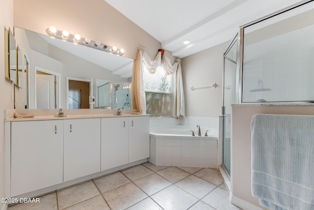 full bathroom featuring tile patterned flooring, a shower stall, double vanity, a bath, and a sink