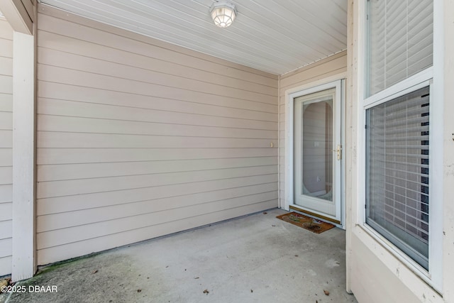 property entrance with a patio area