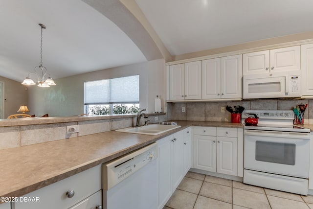 kitchen featuring decorative light fixtures, backsplash, white appliances, and white cabinets