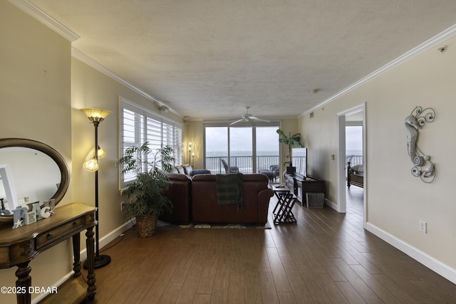 living room with ceiling fan, dark hardwood / wood-style flooring, and crown molding