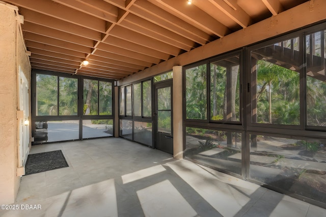 unfurnished sunroom featuring plenty of natural light