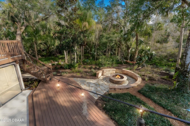 wooden deck featuring a fire pit