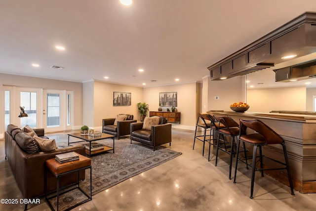 living room featuring crown molding