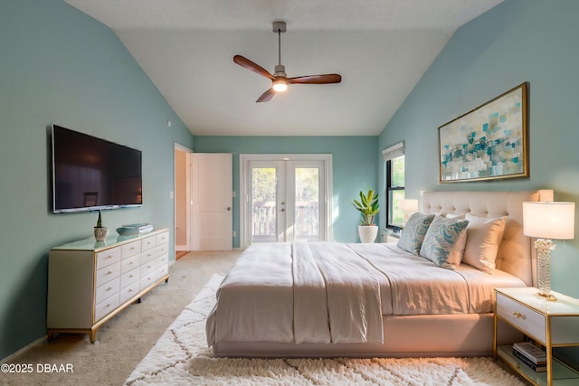 carpeted bedroom with french doors, lofted ceiling, access to outside, and ceiling fan