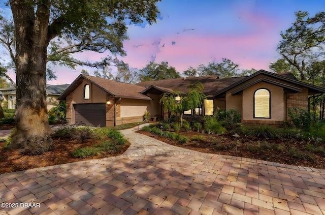 single story home featuring a garage