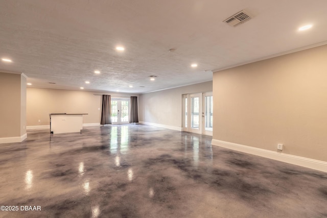 interior space featuring ornamental molding and french doors