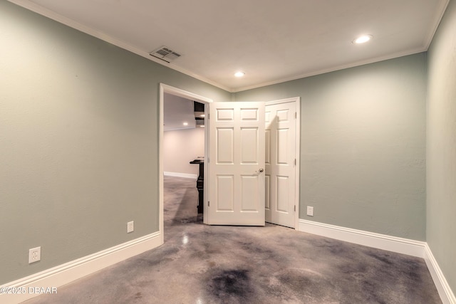 spare room featuring crown molding