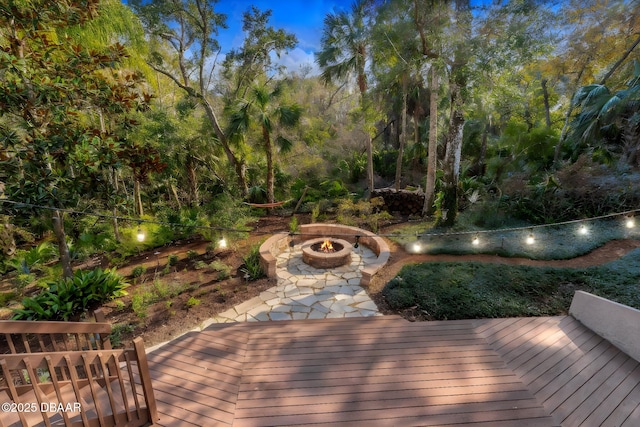 deck featuring an outdoor fire pit