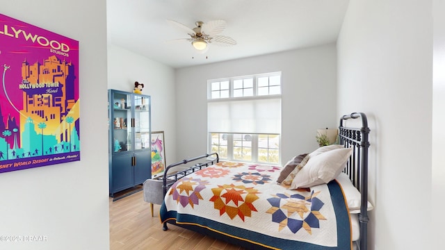 bedroom featuring a ceiling fan and wood finished floors