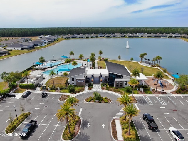 birds eye view of property featuring a residential view and a water view