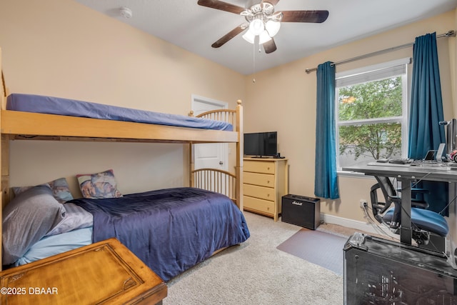 carpeted bedroom featuring ceiling fan and baseboards