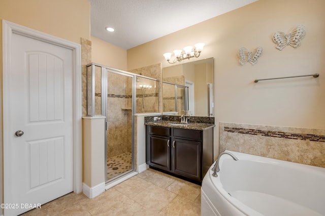 full bathroom featuring a shower stall, tile patterned flooring, a bath, and vanity