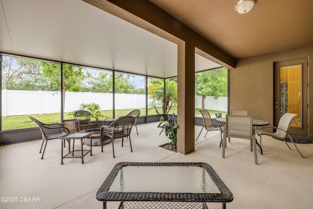 sunroom with outdoor dining space