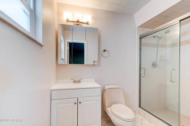 bathroom featuring an enclosed shower, vanity, and toilet