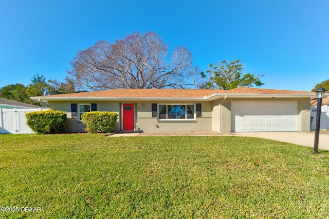 single story home featuring a front yard and a garage