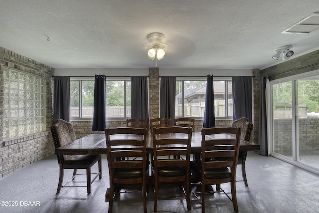 255 Woodhaven Cir W, Ormond Beach, FL 32174 - dining room featuring a textured ceiling, finished concrete floors, and a ceiling fan