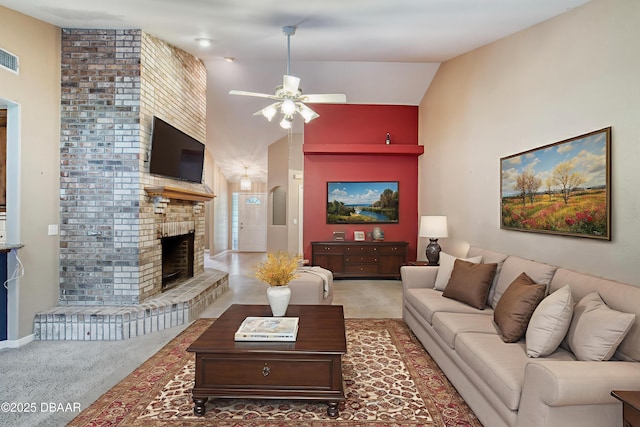 255 Woodhaven Cir W, Ormond Beach, FL 32174 - living room featuring ceiling fan, light carpet, a fireplace, and vaulted ceiling