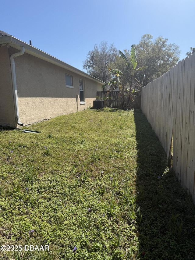 view of yard with a fenced backyard