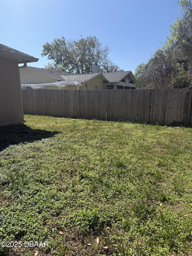 view of yard featuring fence