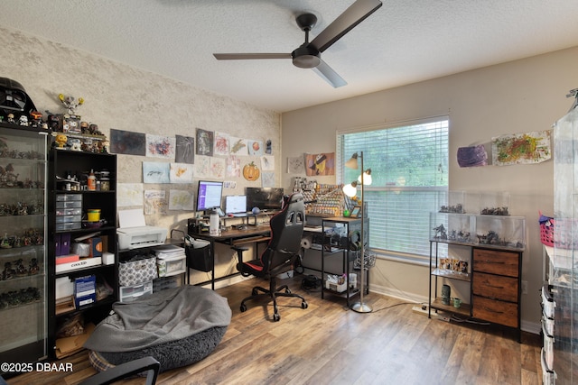 office space featuring hardwood / wood-style floors, a textured ceiling, and ceiling fan